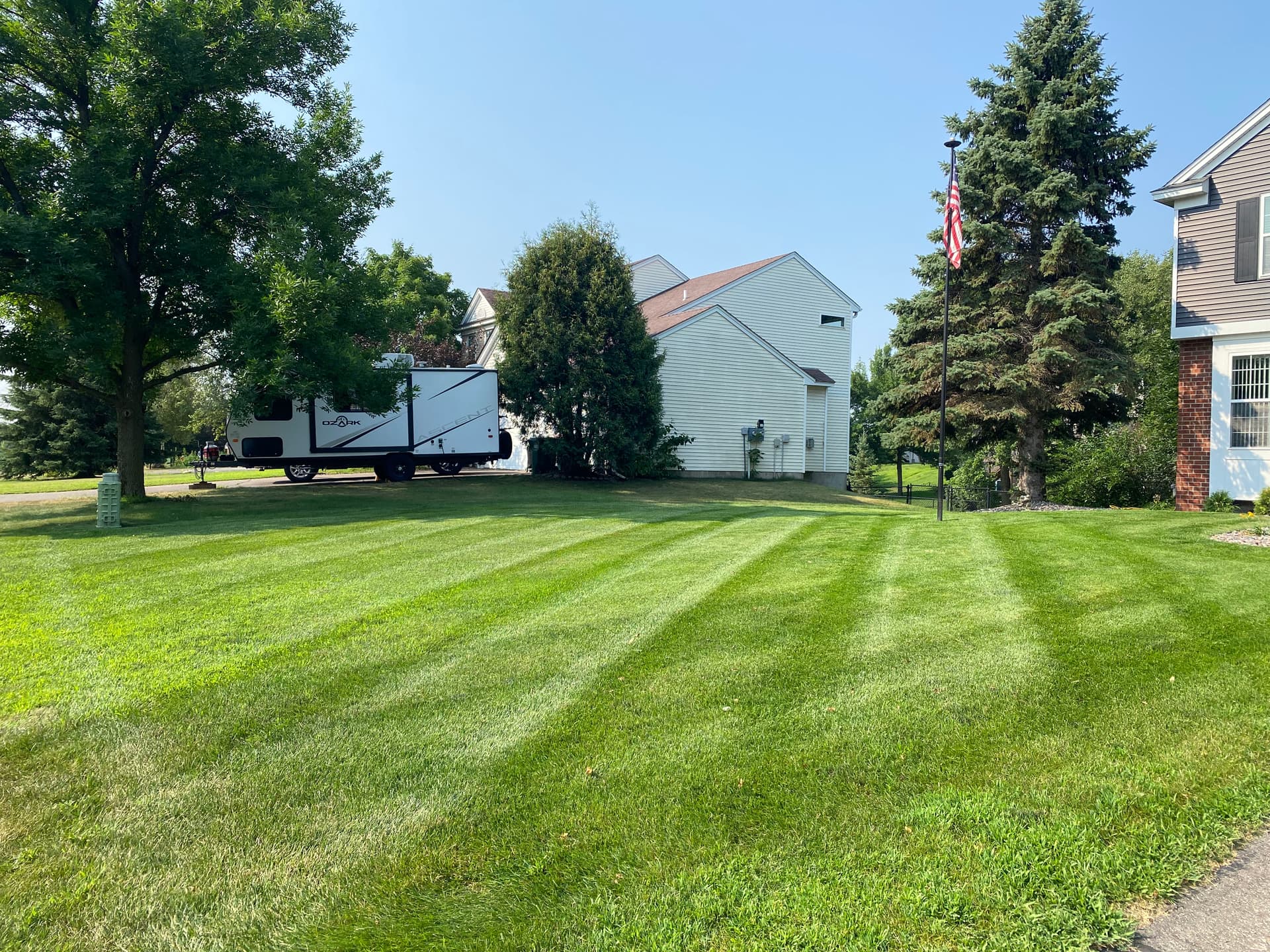 How Consistent Lawn Care Keeps Grass Green Through Summer Heat image